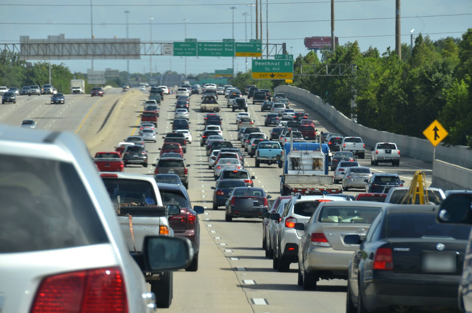 Heavy traffic on a Houston freeway near the Beechnut Street exit